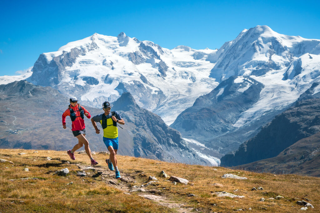 Trail running above Zermatt, Switzerland with Monte Rosa in the background.