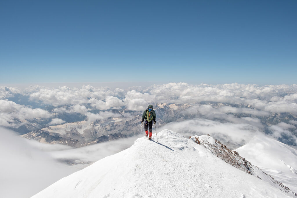 Russia, Upper Baksan Valley, Caucasus, Mountaineer ascending Mount Elbrus