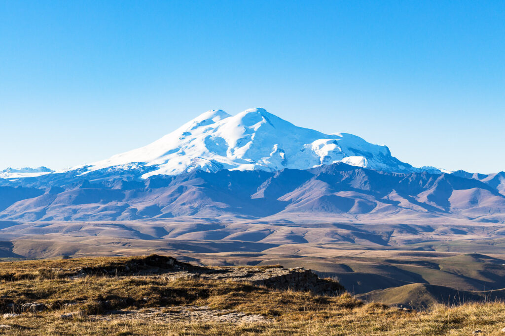 travel to North Caucasus region region - view of Mount Elbrus from Bermamyt Plateau at september morning