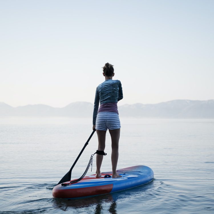 Woman paddling on sup board